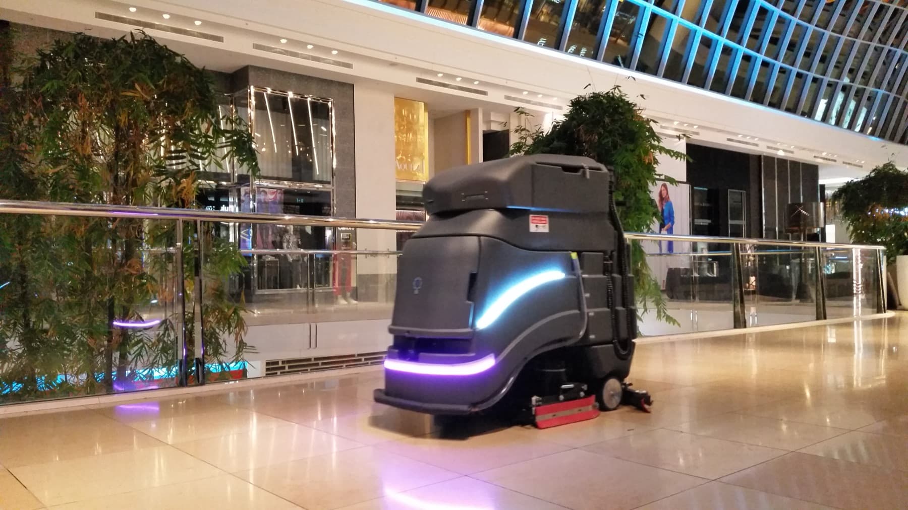 Autonomous floor-cleaning robot operating in a commercial building